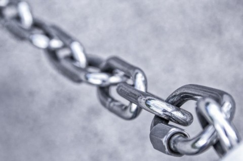 Photo of stainless steel chain links to symbolize a connection