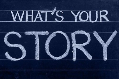 Picture of writing on a chalkboard saying "What's your story"